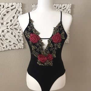 Black and floral appliqué bodysuit
